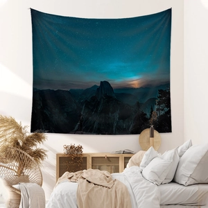 Bohemian tapestry featuring mountain and galaxy night sky for cozy bedroom wall decor