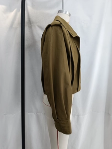 Side view of olive green bomber jacket with lapel collar on a mannequin display
