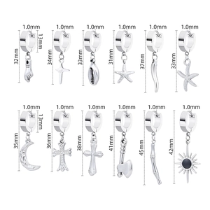 Set of 12 titanium steel hoop earrings featuring cross, moon, and starfish charms