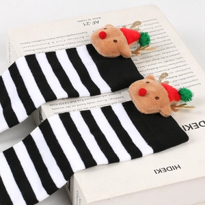 Kids Christmas socks with 3D reindeer plush decor in black and white striped knit