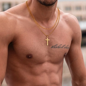 Close-up of double layer gold stainless steel necklace with cross pendant on model