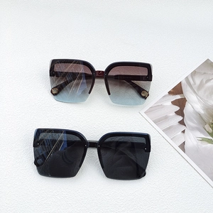 Chic women's oversized square sunglasses in black and gradient brown shades with UV protection