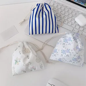 Three-piece set of cute floral and striped drawstring pouches for toiletries storage