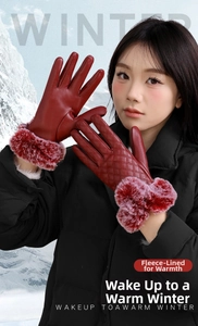 Close-up of dark red PU leather gloves with quilted texture and red faux fur cuffs