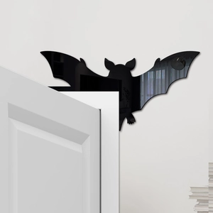 Detail of 3D black mirror acrylic bat sticker decorating a white door frame corner