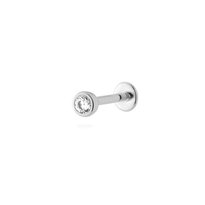 Detailed close-up of a silver labret stud earring with a clear round-cut zircon stone