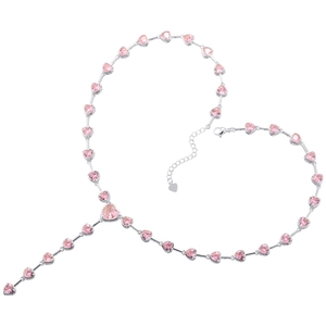 Detail showing elegant silver necklace with pink heart gems arranged in a heart shape