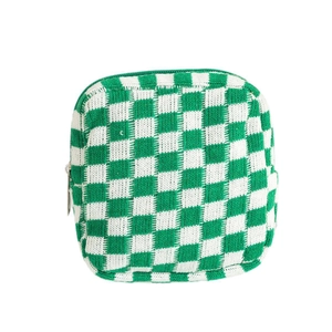 Green and white checkerboard knit storage bag with silver zipper for cosmetics