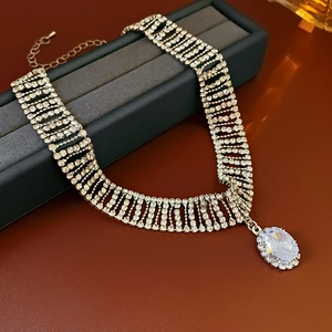 Macro shot of wide multi-row rhinestone choker with large oval crystal pendant