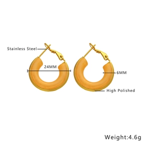 Detailed view of 24mm gold-plated stainless steel earrings with orange resin inlay