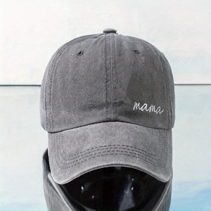 Detail of mama embroidery on a dark grey washed cotton canvas baseball cap