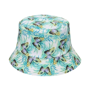 Double-sided bucket hat with butterfly and tropical leaf patterns for sun protection