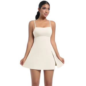Detail of beige athletic dress featuring slim straps and a stylish side slit design