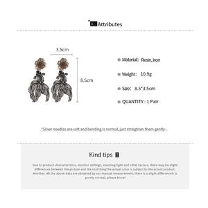 Artistic resin goldfish earrings with flower detail and dimension measurement markings