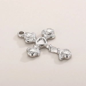 Detailed view of stainless steel cross pendant with floral ends and heart center