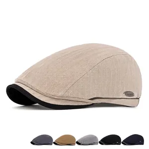 Men's herringbone flat cap with metal logo detail in khaki and multi-color options