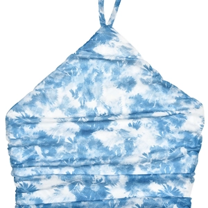 Detailed view of the blue and white tie-dye halter neck dress with ruched textured fabric