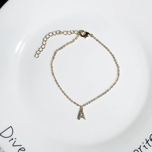 Adjustable 18K gold plated bracelet with letter A pendant encrusted with sparkling zircons