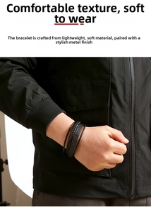 Detail shot of multi-layer black braided leather bracelet featuring textured metal clasps