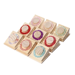 Set of 9 wooden jewelry stands for bracelets and necklaces in a 3x3 grid layout