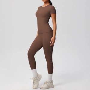 Close-up of coffee brown high-stretch yoga set with slim fit t-shirt and high waist leggings