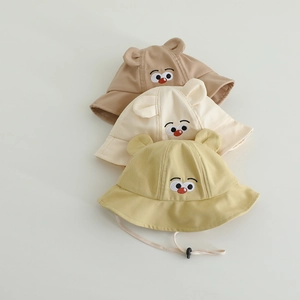 Detailed view of baby cotton sun hats with cartoon eye embroidery and cute ear designs