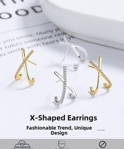 Macro shot of 925 sterling silver X-shaped earrings with pavé cubic zirconia inlay