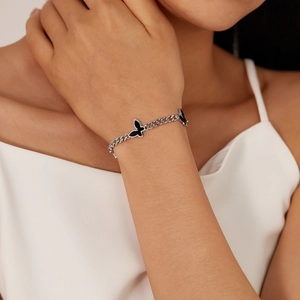 Elegant stainless steel silver chain bracelet with minimalist black butterfly pendants