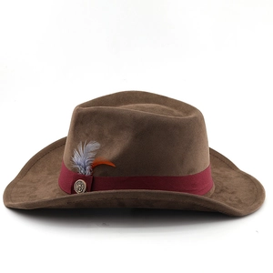 Detail of brown wool felt cowboy hat featuring a red ribbon band and feather accent