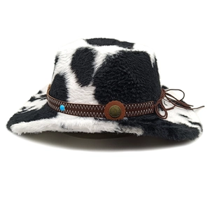 Detail of cow print western cowboy hat featuring blue gemstone and metal sunflower button