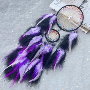 Handmade black double ring dream catcher with purple feathers and gold mesh wall decor