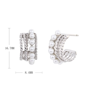 Detail view of silver twisted C-shape earrings with white pearls and size measurements