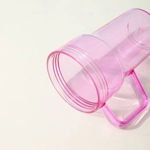 Pink transparent plastic water bottle with handle and screw top shown at an angle