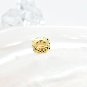 Gold plated hollow flower spacer bead with intricate filigree for jewelry making