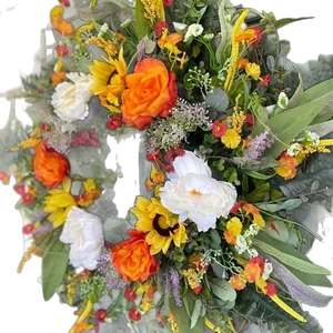 Colorful summer wreath with orange roses, yellow sunflowers and eucalyptus on white background