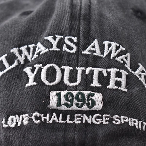Vintage washed cotton baseball cap with YOUTH 1995 embroidery in dark charcoal grey
