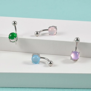 Detailed view of colorful translucent stones on stainless steel 14g navel rings
