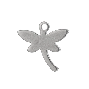 Macro view of a matte silver dragonfly pendant made of stainless steel for DIY jewelry