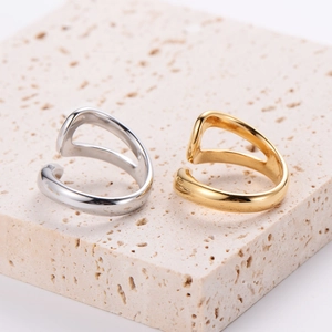 Minimalist stainless steel infinity open ring in gold and silver finish on stone base