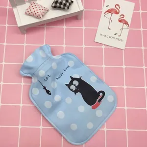 Mini blue hot water bottle with plush dot cover and cartoon cat, shown from a 45-degree angle