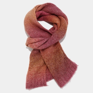 Close-up of thick tie-dye knitted scarf with gradient orange and purple mohair texture
