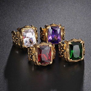 Retro punk style rings in antique gold with vibrant rectangle ruby and emerald gemstones