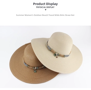 Detail of summer straw hats with wide brims featuring decorative starfish pendants