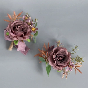 Dusty rose silk boutonniere set with purple accents and twine wrapped stems for weddings