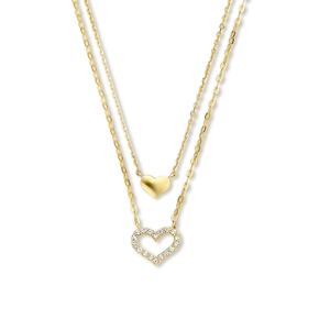 Detail of golden double-layer necklace featuring solid and hollow heart pendants with rhinestones