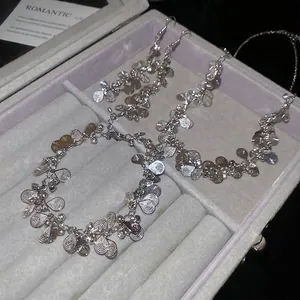 Elegant silver tassel jewelry set with water-drop sequins and engraved textures