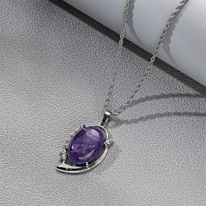 Macro detail of natural purple amethyst heart pendant necklace in silver ornate setting