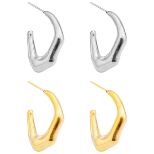 Detailed view of irregular C-shaped 18K gold and silver plated stainless steel earrings