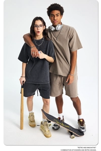 Lifestyle shot of oversized washed cotton street style t-shirt and shorts set in charcoal