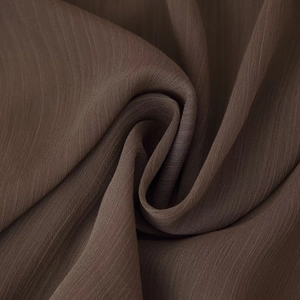 Bohemian deep brown sleeveless short dress featuring pleated breathable fabric texture